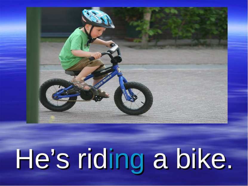 He’s riding a bike.